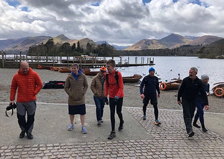 Staniforth and colleagues in front of a lake