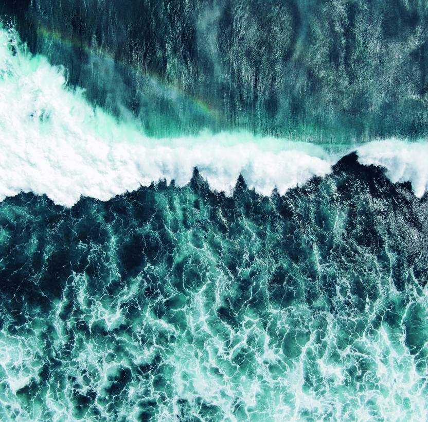 An image of a green/blue wave crashing